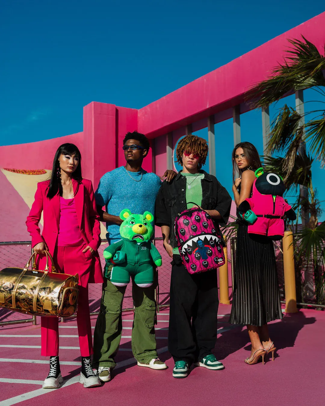 Sprayground X Squid Game Lined Up Front Man & Pink Guard Shark DLXSV Backpack