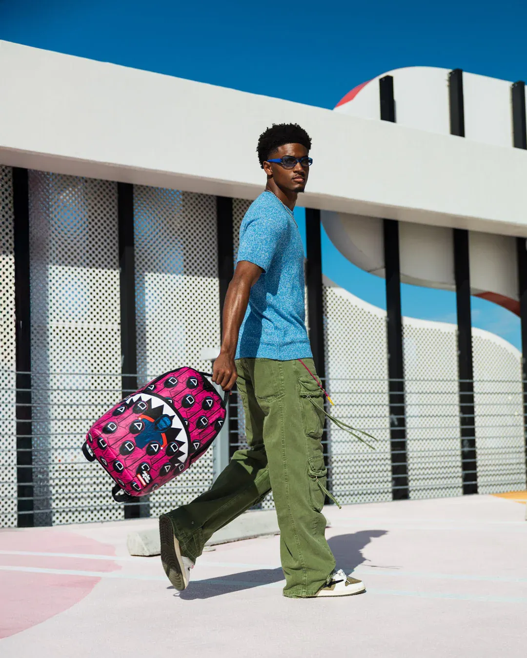 Sprayground X Squid Game Lined Up Front Man & Pink Guard Shark DLXSV Backpack